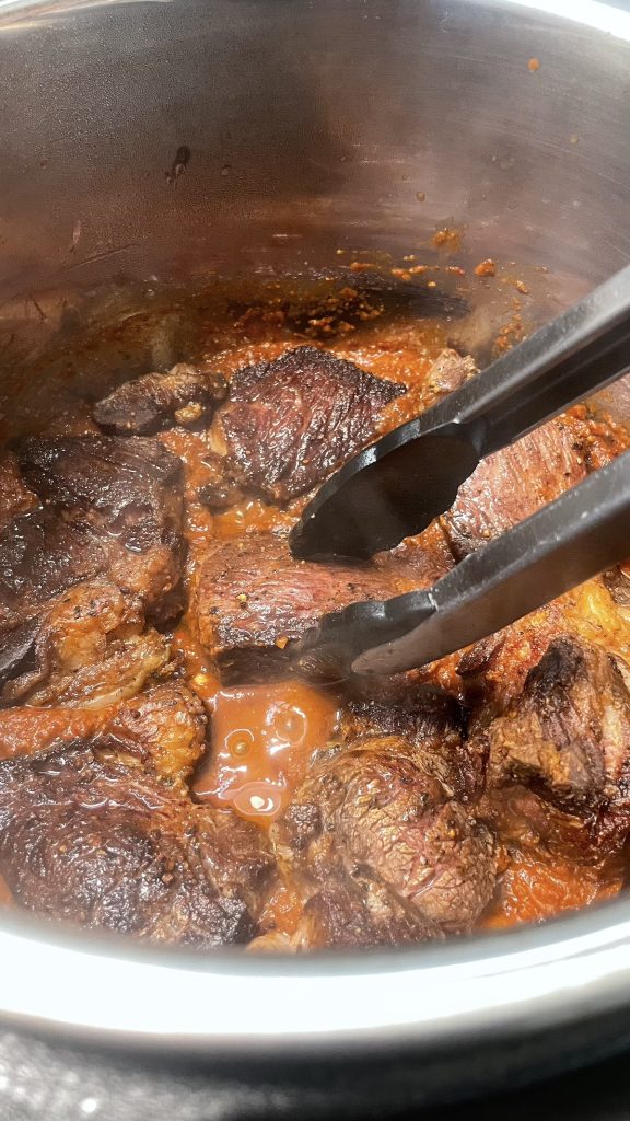 Add meat to the chili base